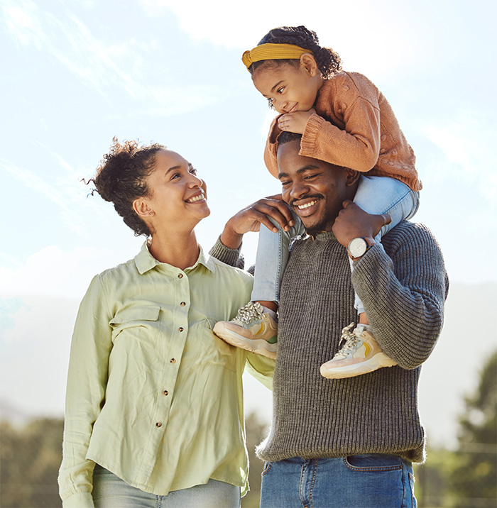 parents-smile-at-daughter-on-father-s-shoulders-2026-09-24-14-04-12-utc